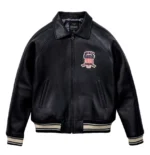 men’s black leather bomber jacket with large AVIREX USA lettering, embroidered patch, striped rib hem and cuffs, and aviator varsity style design.