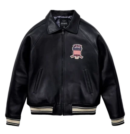 men’s black leather bomber jacket with large AVIREX USA lettering, embroidered patch, striped rib hem and cuffs, and aviator varsity style design.