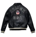 Men’s black leather bomber jacket with front zip closure, shirt collar, ribbed cuffs, side pockets, and aviator varsity patch details.