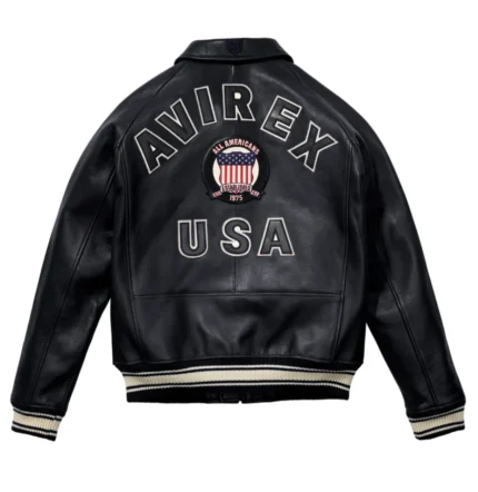 Men’s black leather bomber jacket with front zip closure, shirt collar, ribbed cuffs, side pockets, and aviator varsity patch details.