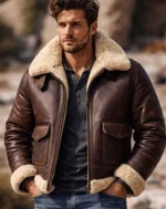 Men’s brown leather bomber jacket with faux fur trim, front zip closure, and flap pockets