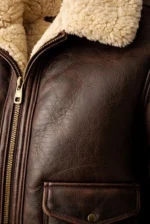 Men’s brown leather bomber jacket with faux fur trim, zip closure, and flap pockets