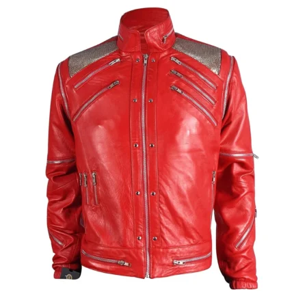 "Michael Jackson Inspired Red Leather Jacket featuring premium red leather, multiple silver zipper details, metallic shoulder panels, a stand-up collar, and front zipper closure."
