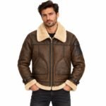 Men's brown B3 leather bomber jacket with cream shearling collar, cuffs, and hem