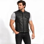 Man wearing the Shadow Reaper black leather vest with snap-front chest pockets, zippered pockets, and lace-up side panels.