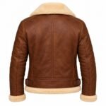 Brown leather jacket with cream shearling lining, broad collar, detailed stitching, adjustable waist buckles and plush cuffs and hem against a white studio background.