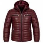 Crimson Burgundy Puffer Jacket featuring a padded hood, horizontal quilted panels, full front zipper, chest pockets, and lower zippered pockets.