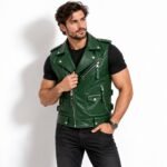 Man wearing the Evergreen Renegade Leather Vest in deep emerald green with asymmetrical zipper, silver hardware, and multiple utility pockets.