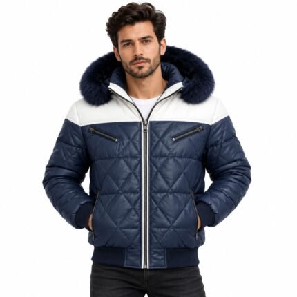 Man wearing the Frostline Blue Quilted Fur Hood Jacket with white shoulder panels, diamond quilting, navy fur-trimmed hood, front zipper, and ribbed cuffs against a white background.