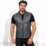 Man wearing the Graphite Shadow Grey Leather Vest with a stand-up collar, central zipper, and practical zippered pockets.