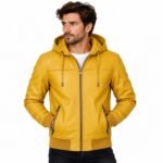 Men’s mustard hooded leather jacket with drawstring hood, full front zipper, angled zip pockets, ribbed cuffs and hem