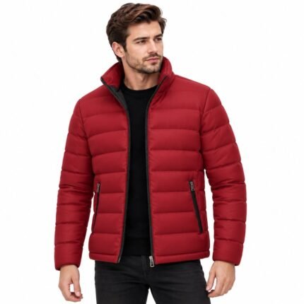 Man wearing the VOLT Red Puffer Jacket with raised collar, horizontal quilted panels, full front zipper, and practical zippered pockets against a white background.