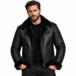 Obsidian black shearling jacket with a plush shearling collar, smooth leather finish, metal zipper, angled pockets and structured detailing.