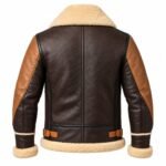 Brown leather bomber jacket with tan leather panels, buckle details, and fur trim