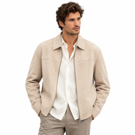 Man wearing a light beige suede jacket with pointed collar, front zipper, and clean panel stitching